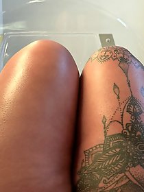 A very sexy woman is naked in these photographs.