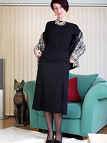 Naughty housewife stripping and teasing