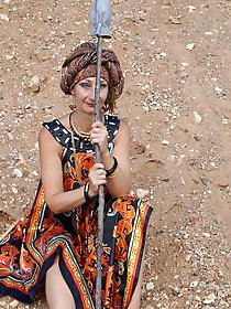 With spear wearing in colorful dress