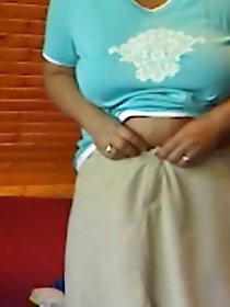 Fiery older woman is fingering her holes