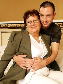 Horny mature slut playing with her toy boy