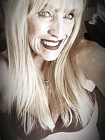 Real older whore is revealing her breasts